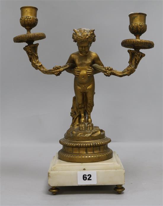 An ormolu faun candelabrum